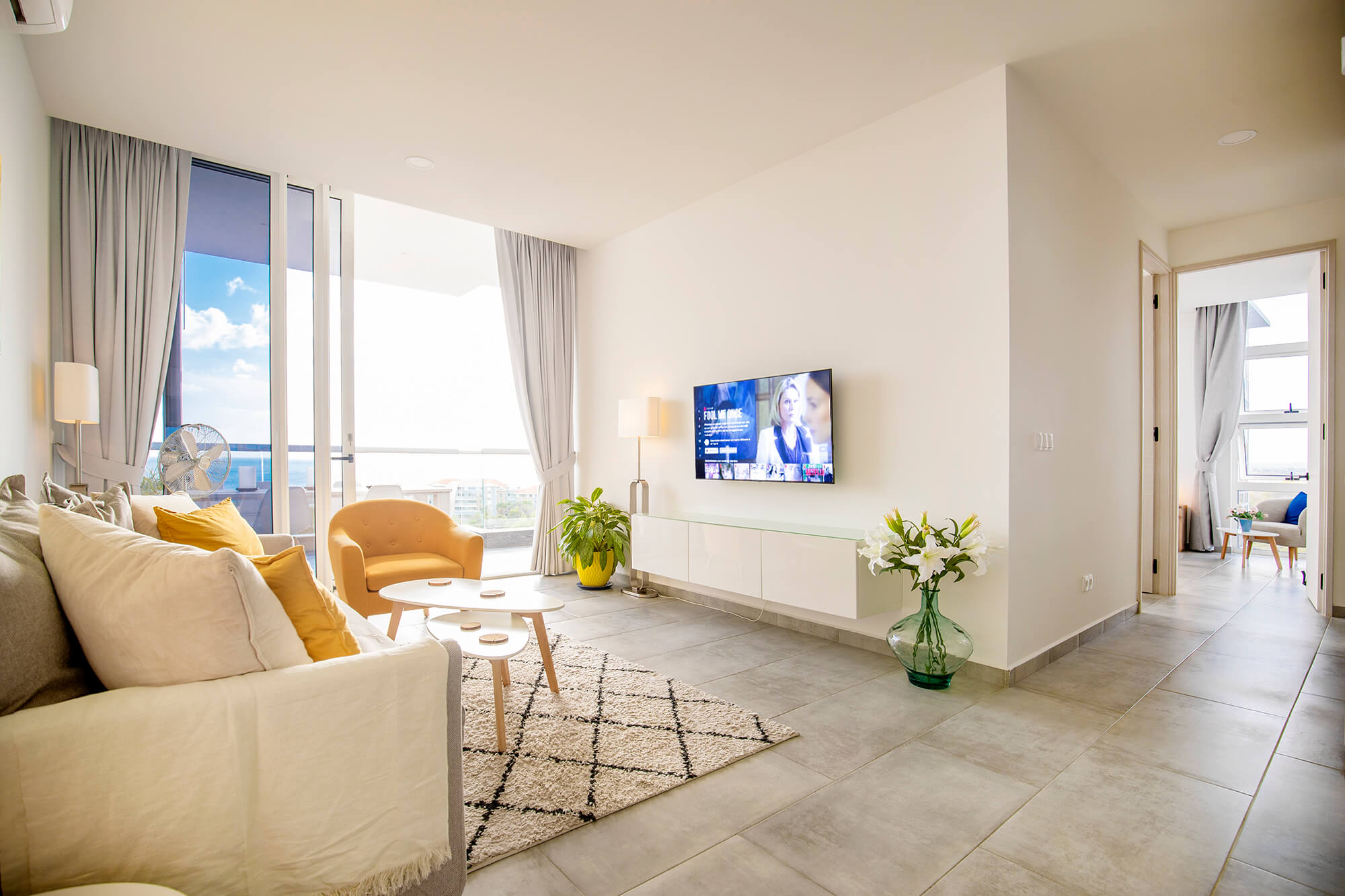 a living room with a television and a couch