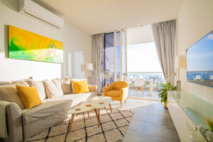 a living room with a couch and chairs